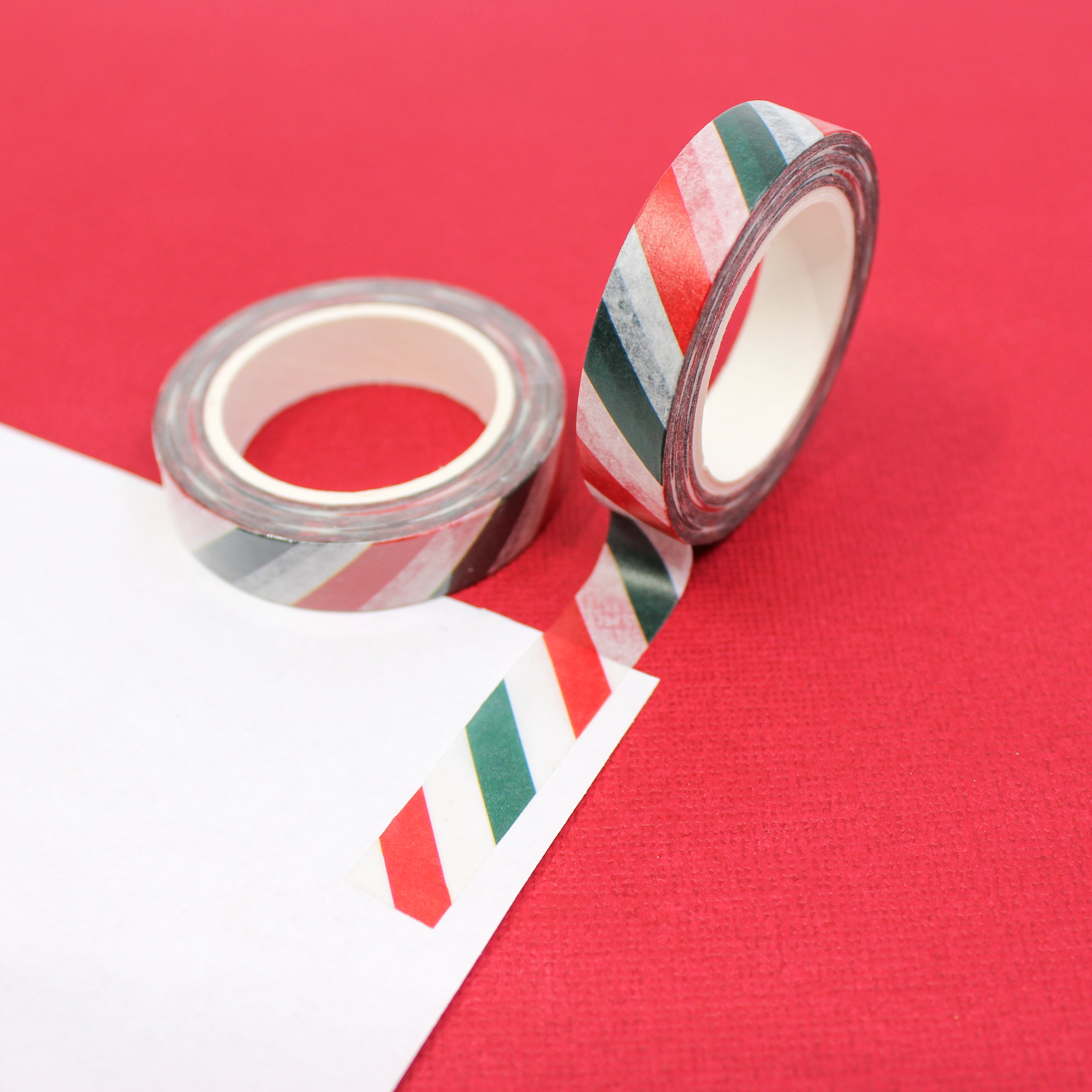 This is a red, green and white Holiday diagonal stripe washi tape from BBB Supplies Craft Shop