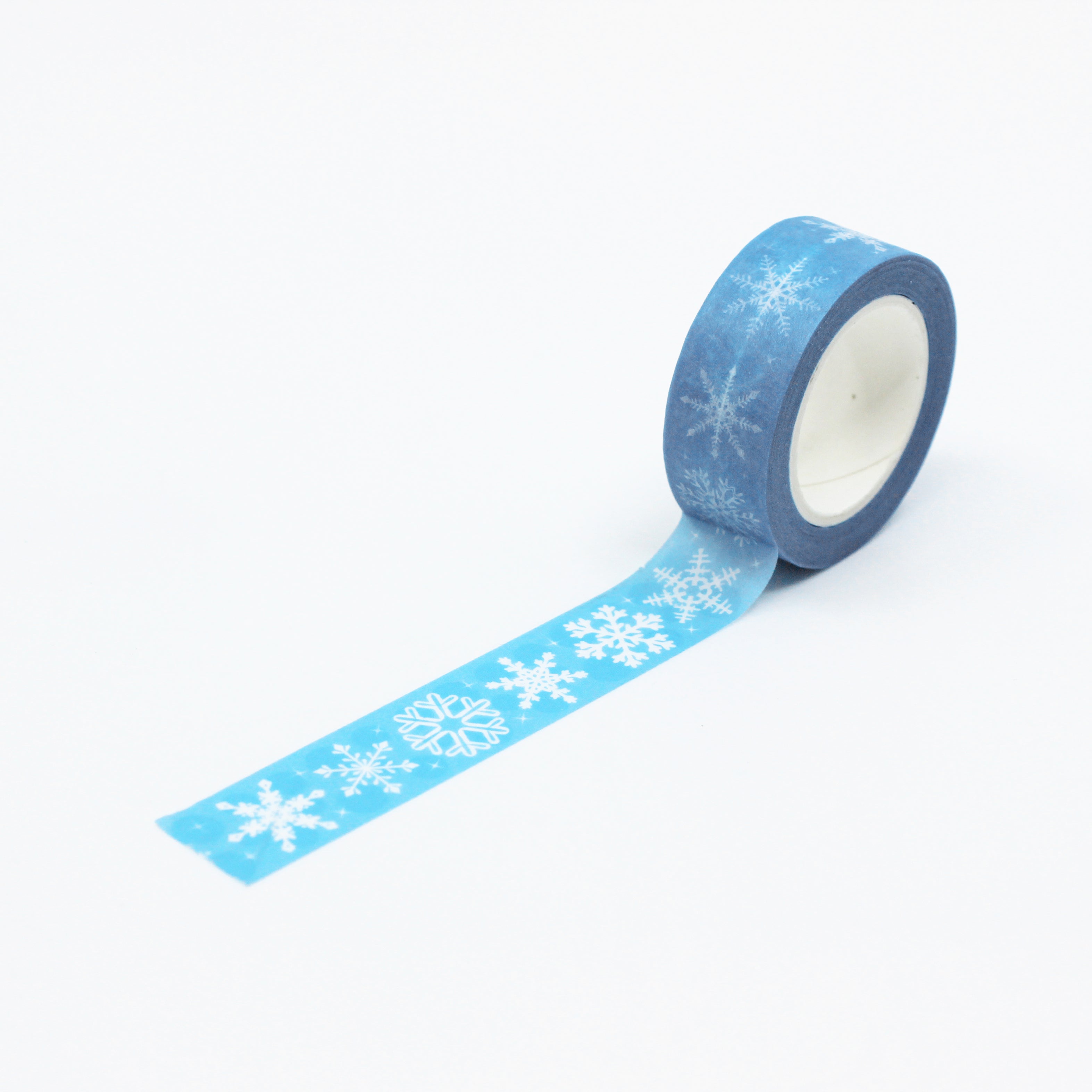 This is a full pattern repeat view of light blue snow flakes washi tape from BBB Supplies Craft Shop
