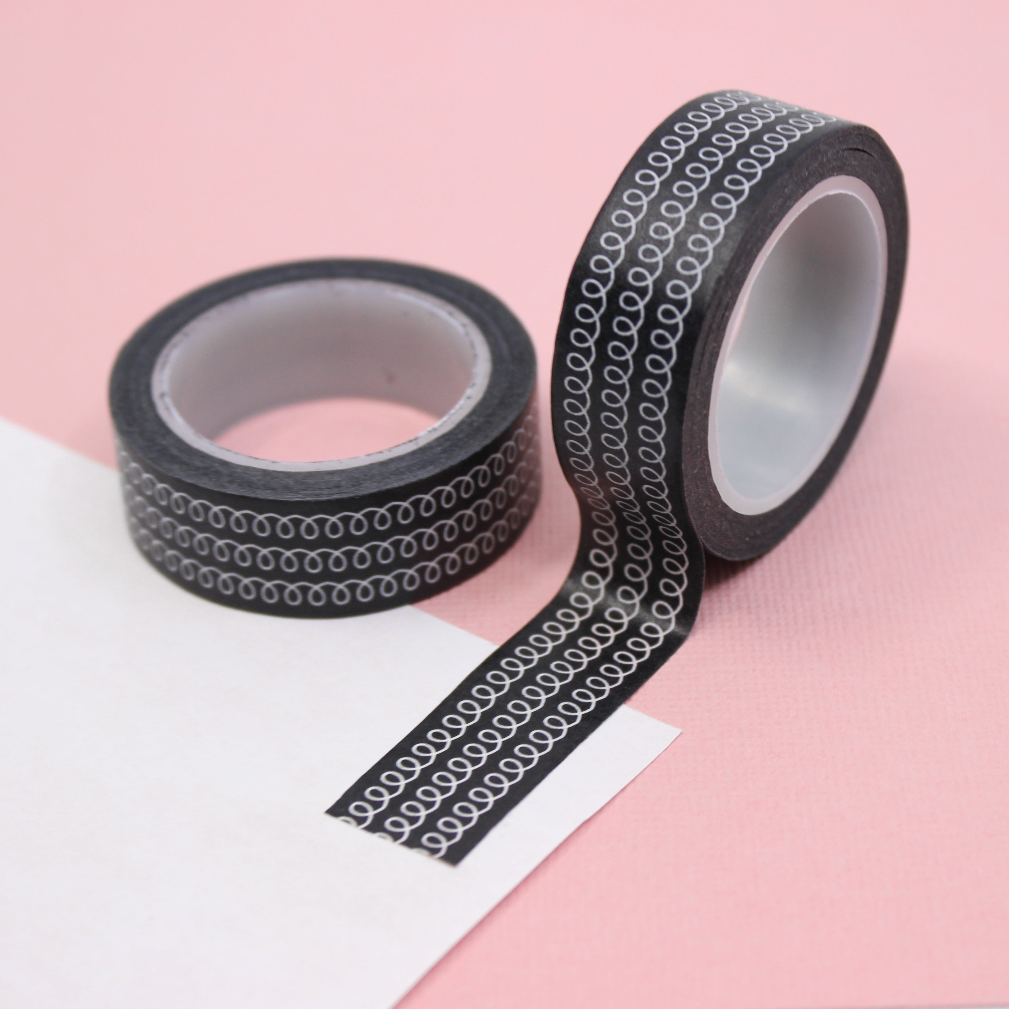 This is a black tape with swirl lines view themed washi tape from BBB Supplies Craft Shop