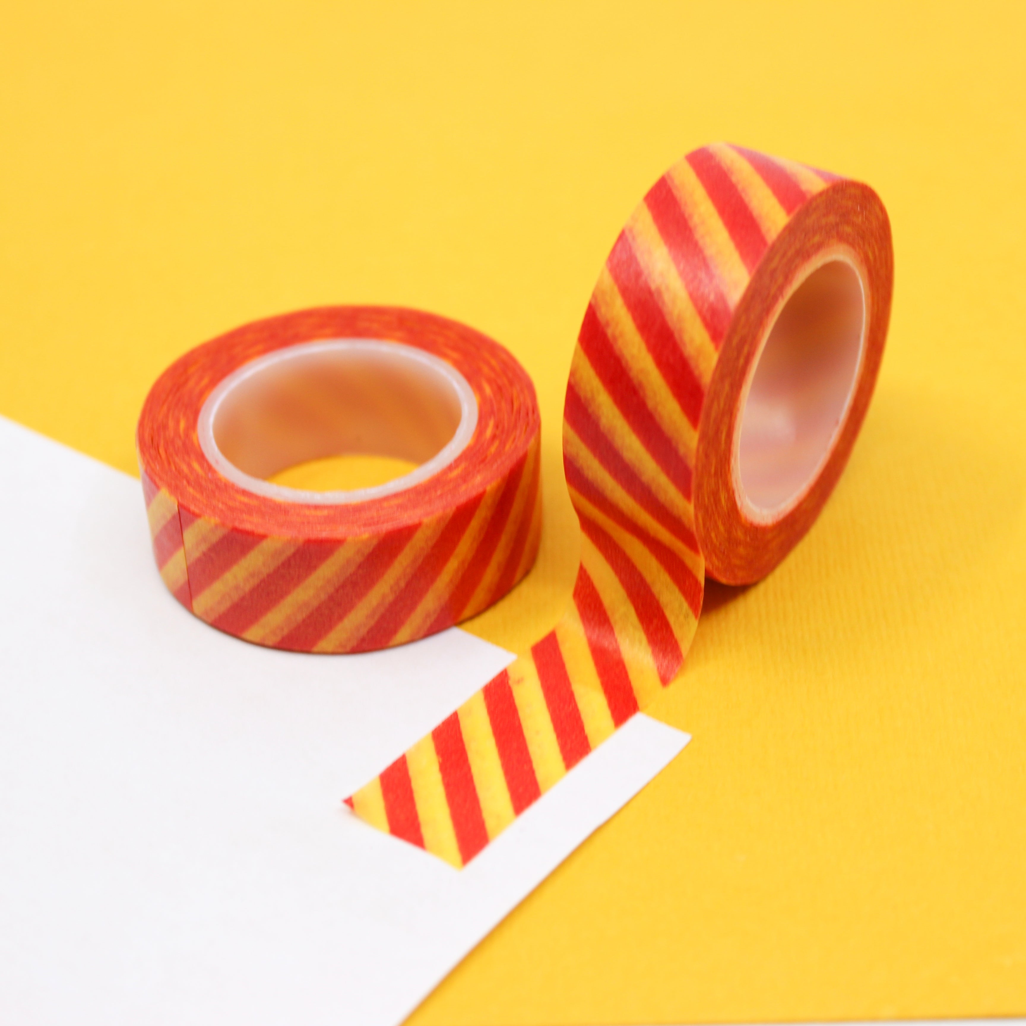 This is an orange and yellow diagonal stripe view themed washi tape from BBB Supplies Craft Shop