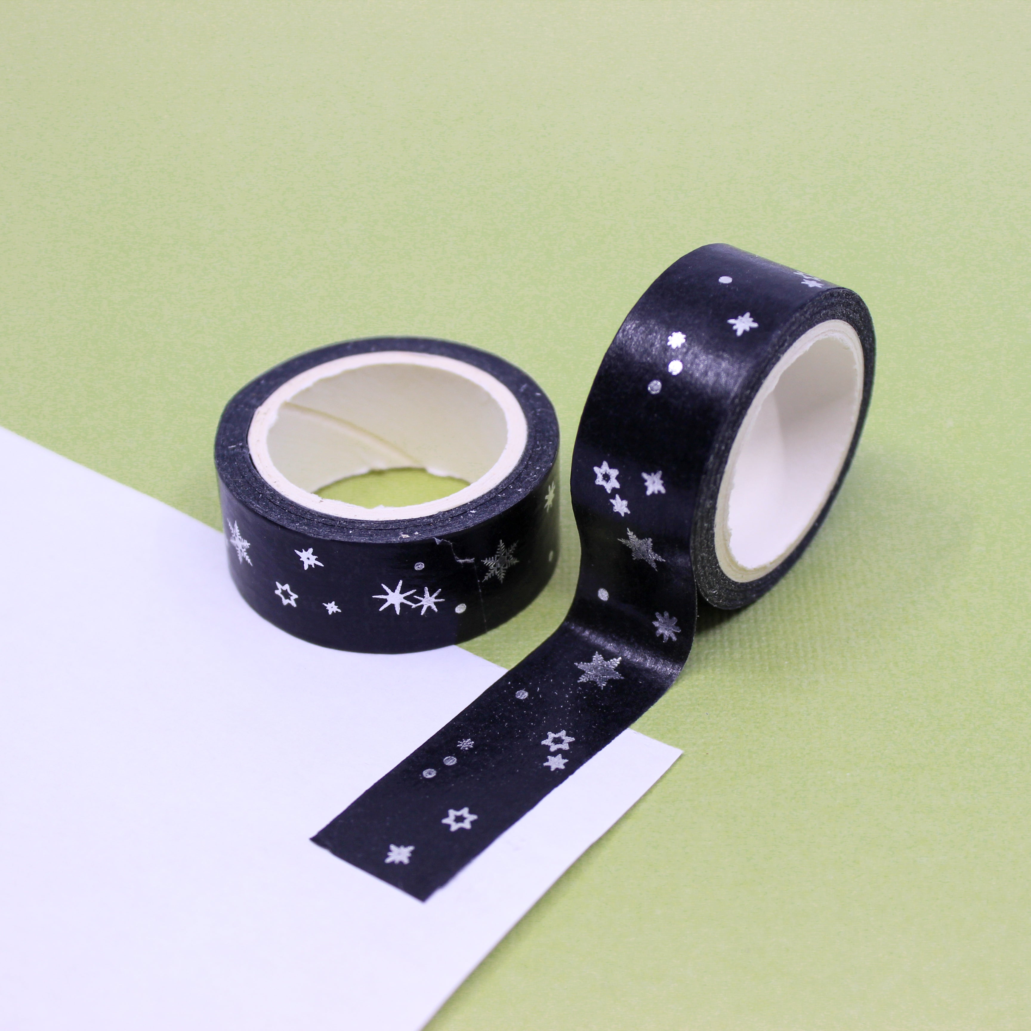 This is white and silver foil snowflakes and star at one black night Washi Tape from BBB Supplies Craft Shop