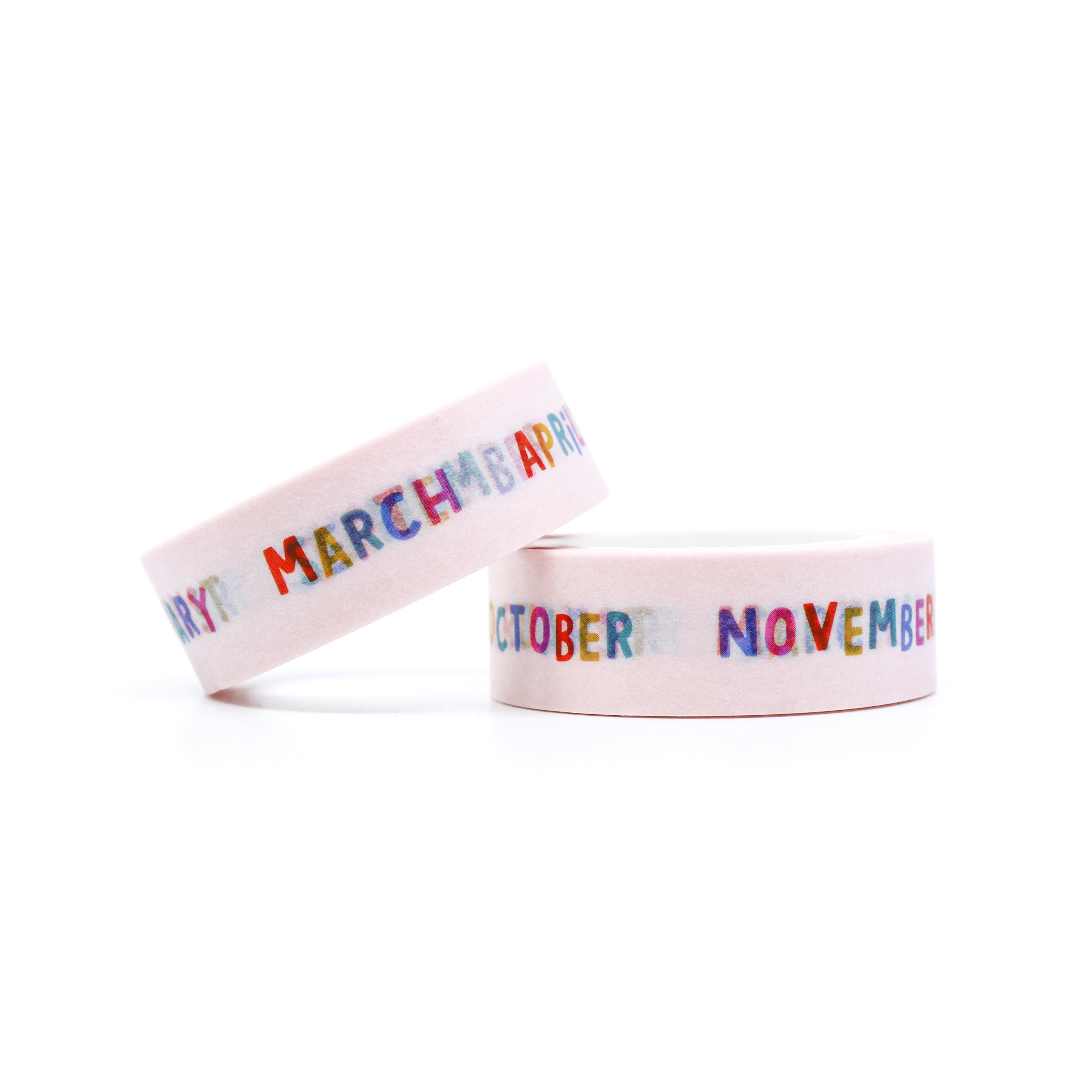 This is a roll of rainbow name of the month with white background washi tapes from BBB Supplies Craft Shop