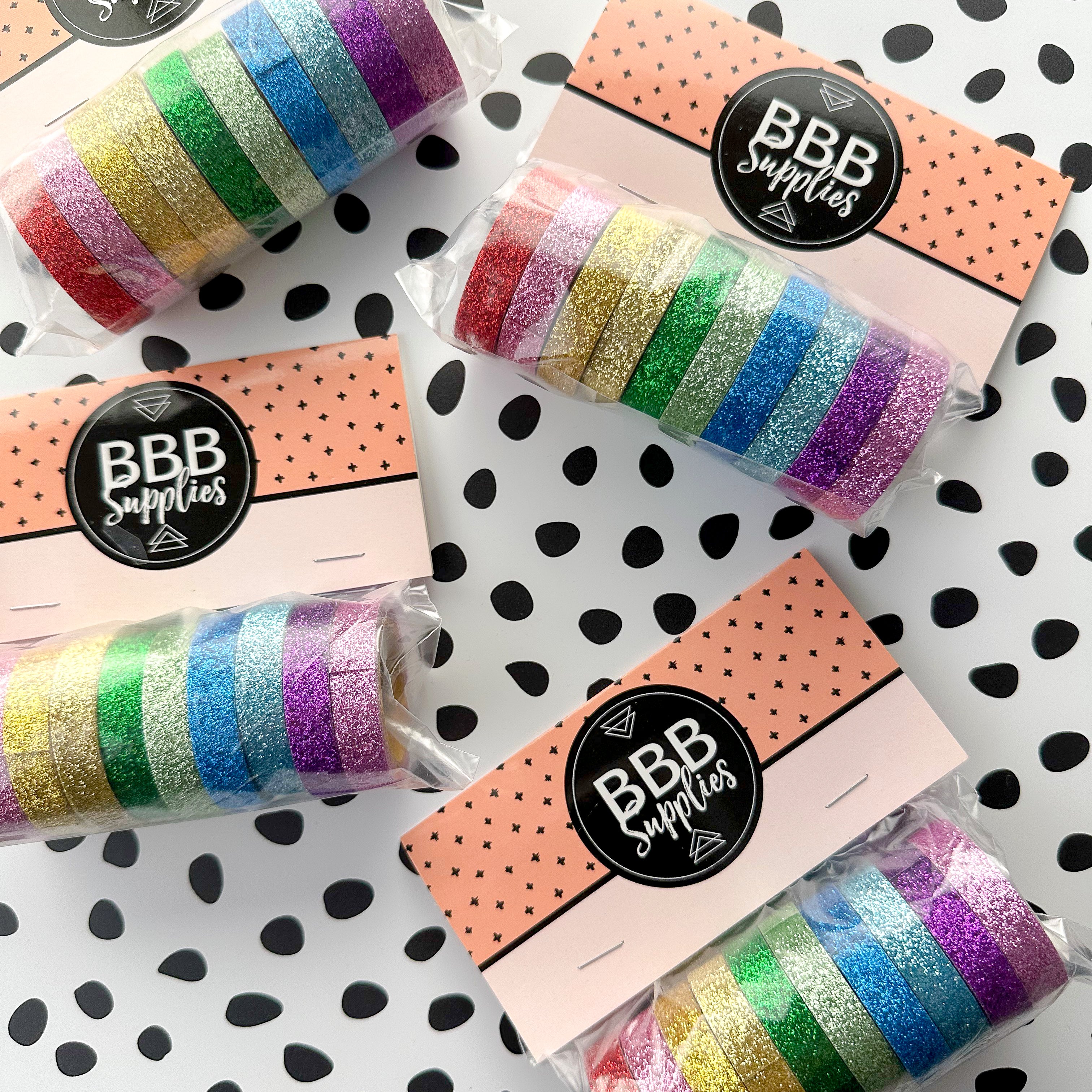 This set of washi tape is perfect for multiple projects. The set includes pastel and primary red, blue, yellow, green, blue, and purple glitter tapes. This tape will add some sparkle to any project. This set is sold at BBB Supplies Craft Shop.