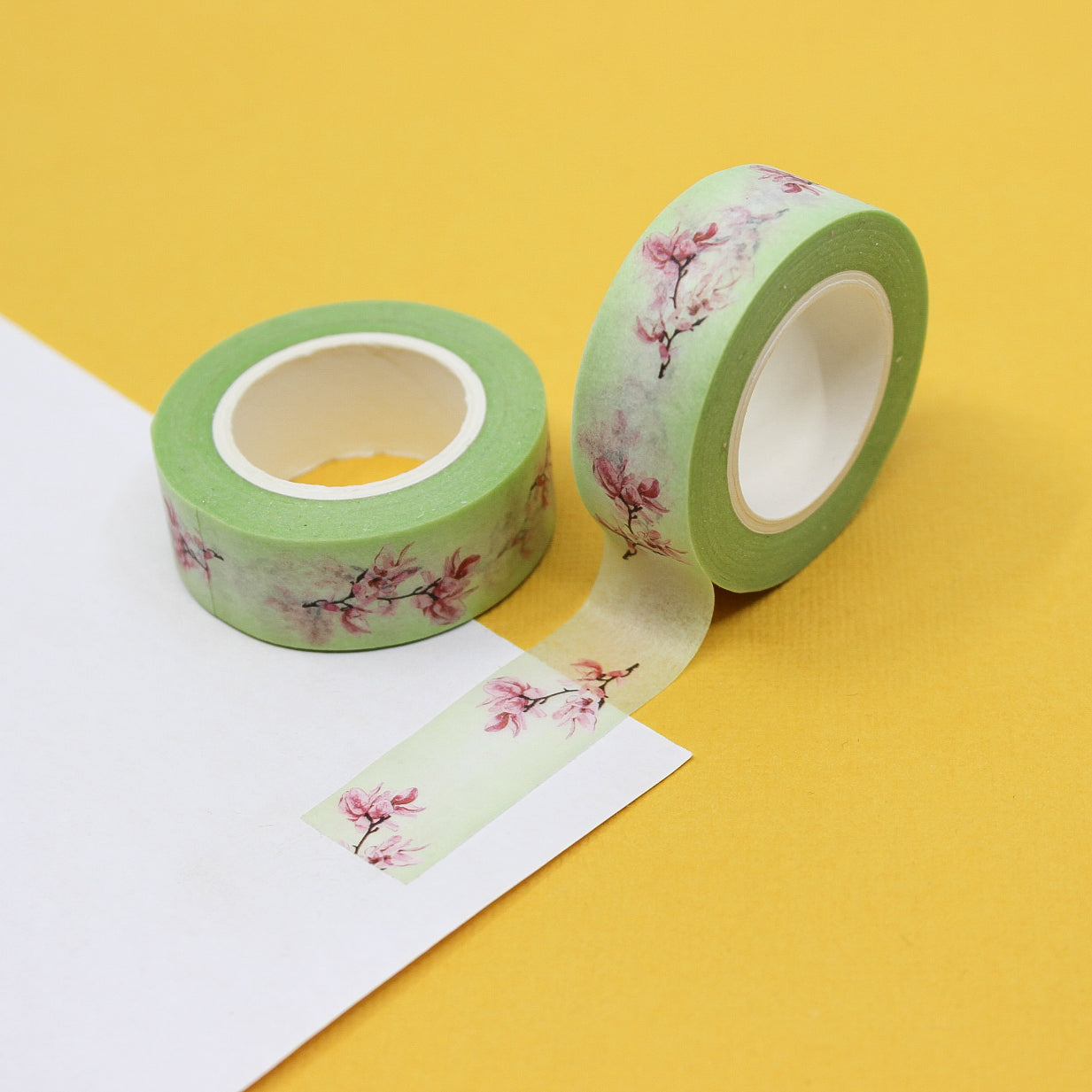 This pretty pastel cherry blossom tape is perfect for your craft project or spread. The pastel mint green and soft pink colors make this a beautiful addition to you washi collection.