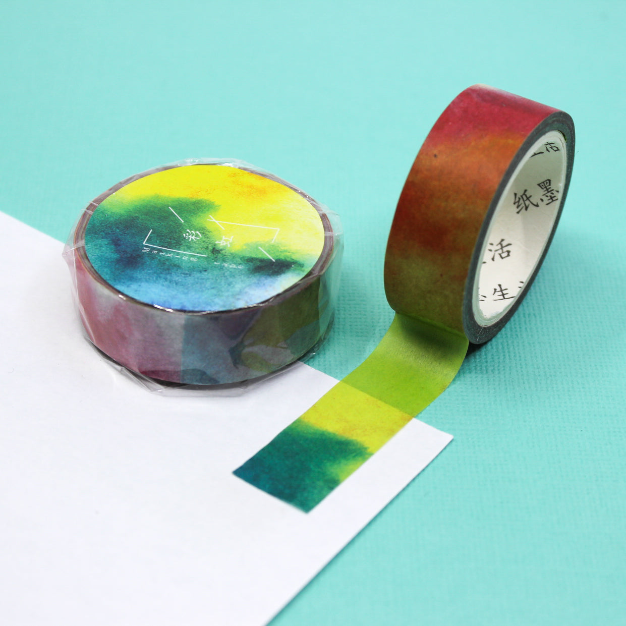 This rainbow ombre watercolor washi tape is the perfect addition to your washi collection. The simplicity of the pattern is perfect for accenting and matching any project's theme while adding a beautiful and interesting pattern. This tape is sold at BBB Supplies Craft Shop.