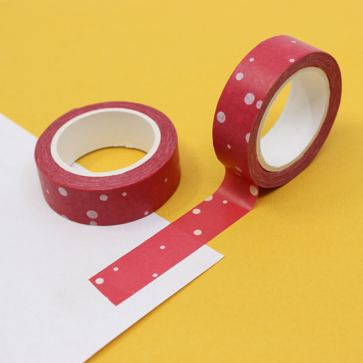 This is a cute washi tape featuring red and white random dots. It is perfect for the holidays or year round craft projects and spreads. This tape is sold at BBB Supplies Craft Shop.