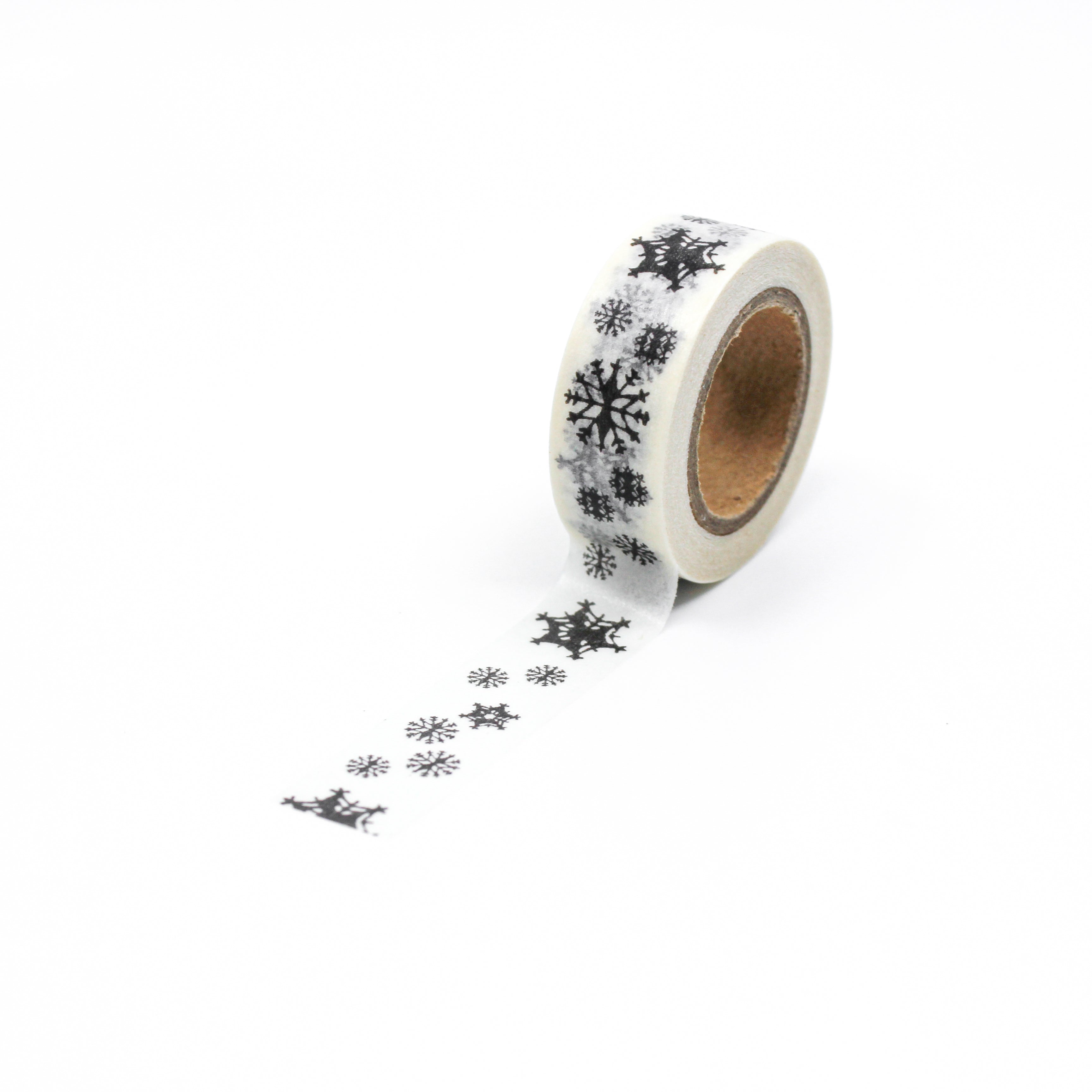 This is a full pattern repeat view of black snowflakes washi tape from BBB Supplies Craft Shop