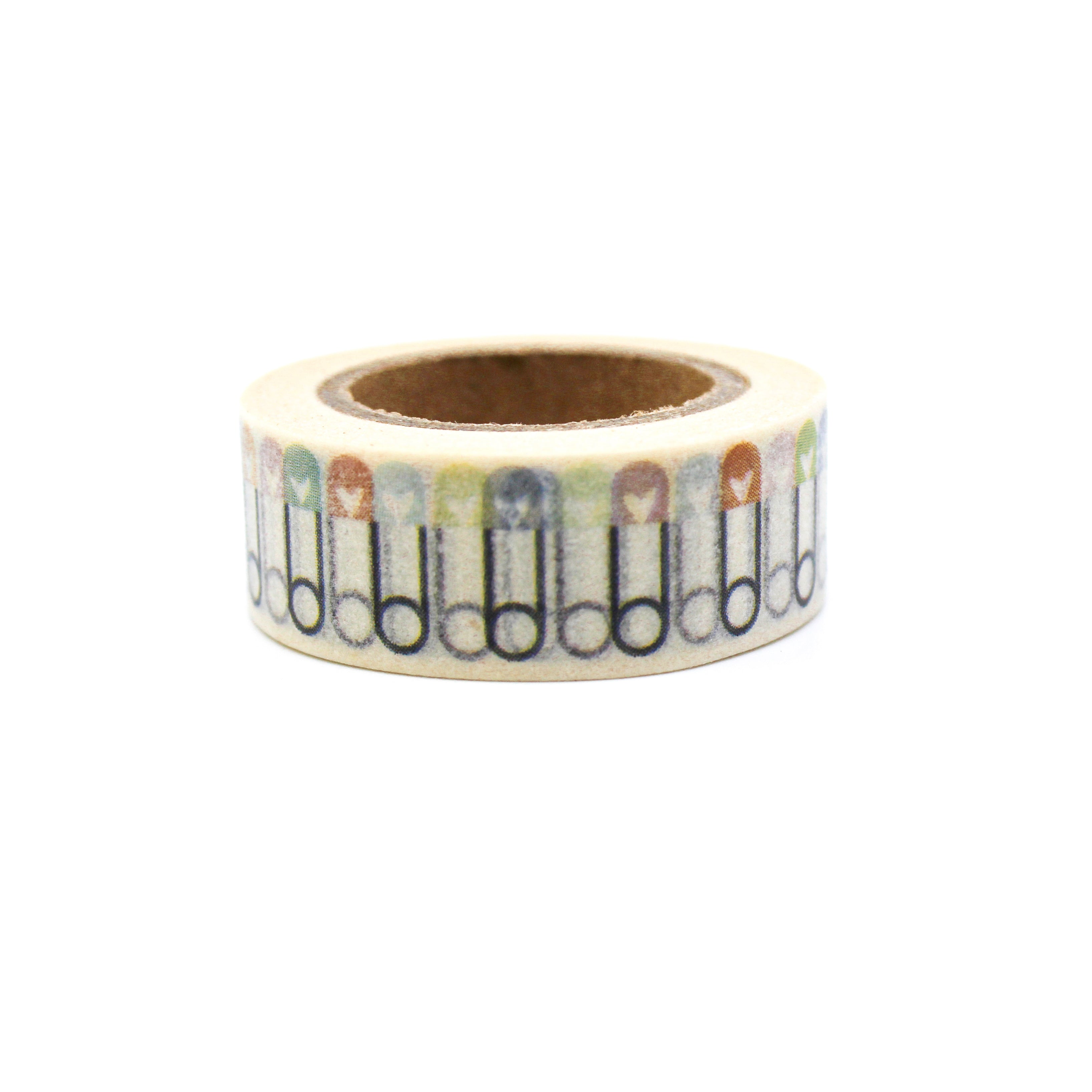 This is a colorful baby clothes pin in a white background washi tape from BBB Supplies Craft Shop