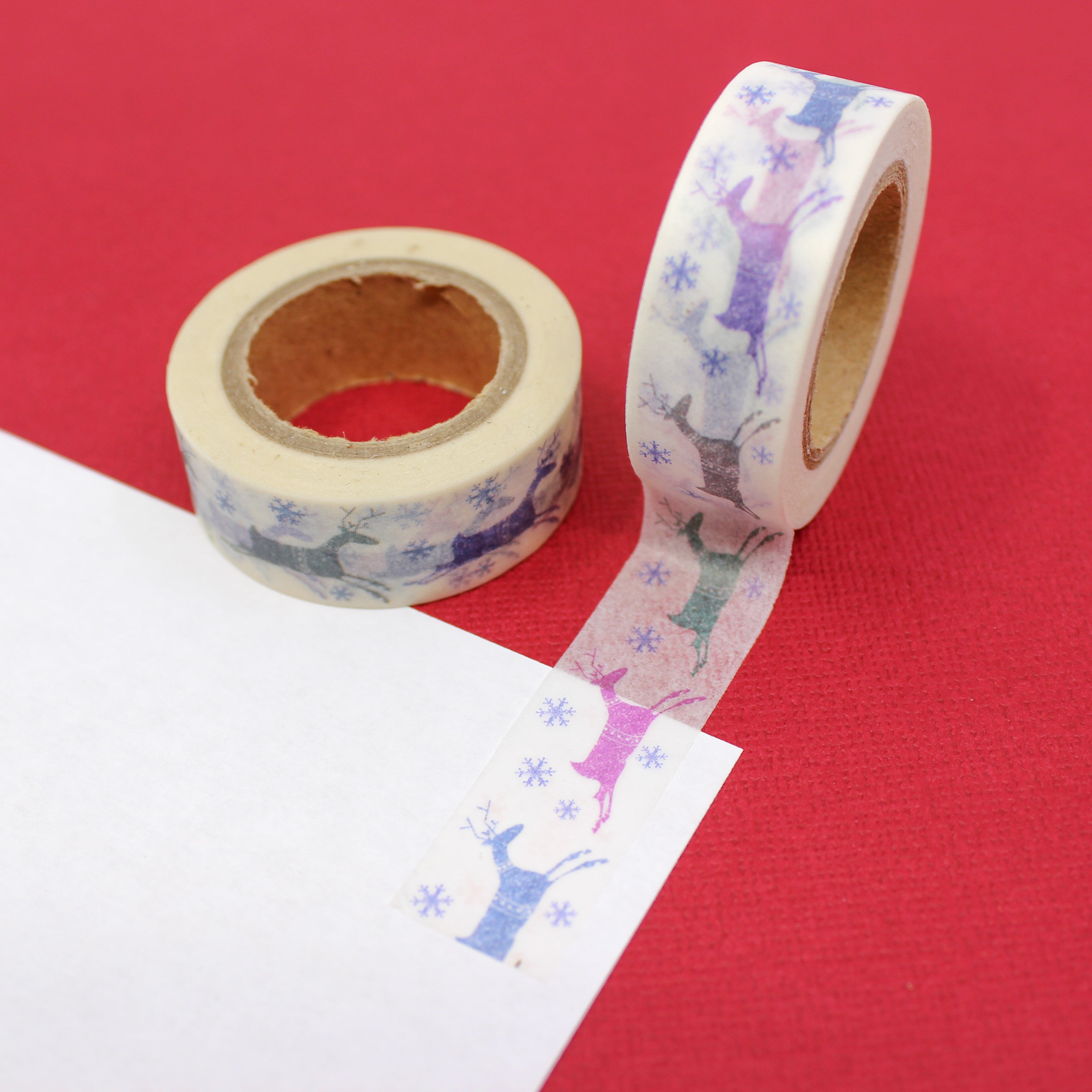 This is a purple and pink leaping reindeer pattern Washi Tape from BBB Supplies Craft Shop