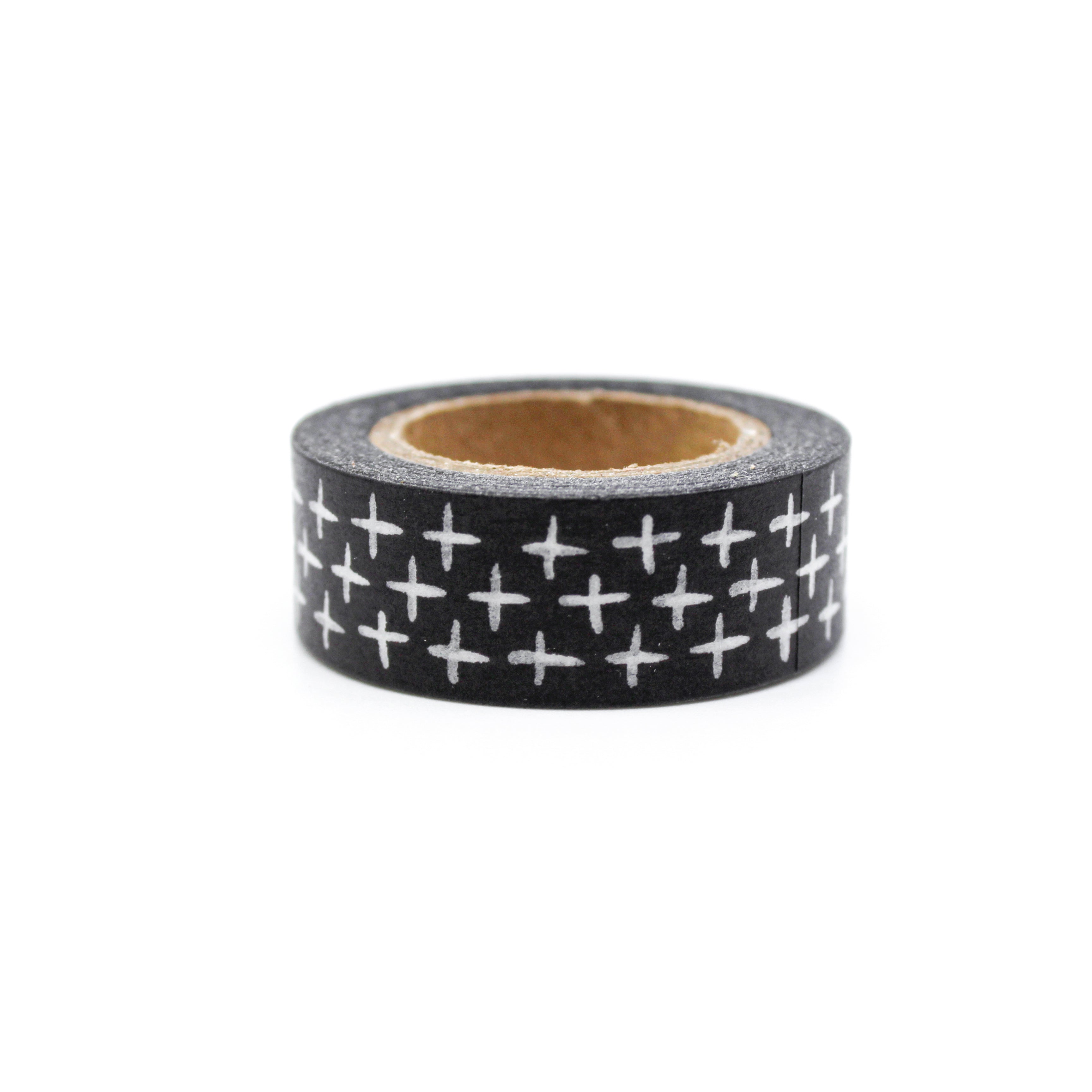 This is a white handwritten cross in a black background washi tape from BBB Supplies Craft Shop